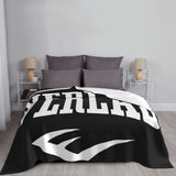 Couverture Everlast, drapé sur lit