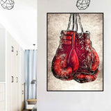 Tableau gants de boxe rouge affiché sur mur hall d'entrée