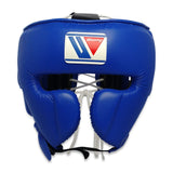 Casque de boxe Winning FG-2900 bleu, vue de face, protections pommettes et écusson Winning