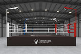 Ring de boxe de compétition avec éclairage candélabre intégré aux poteaux