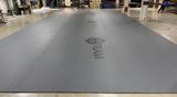 Tapis de sol grande dimensions (16m x 9m deplié) pour un club de MMA