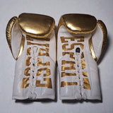 Gants de compétition doré